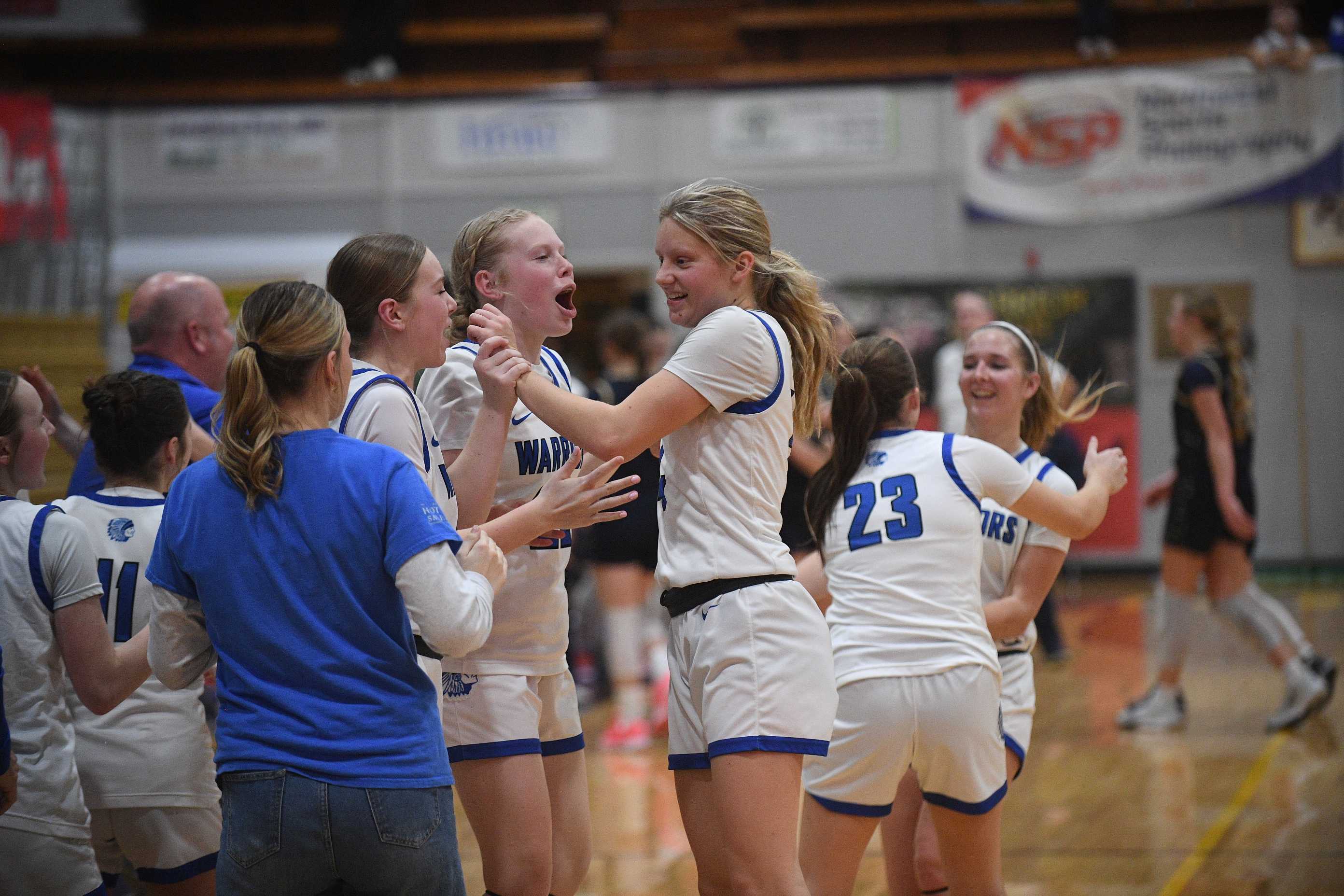 Amity celebrates its win over Banks in the girls semifinals on Friday at Marshfield. (John Gunther photo)