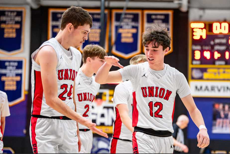 Union's Derek Miller (12) celebrates with teammate Joey McCraw. (Photo from Elijah Newton)