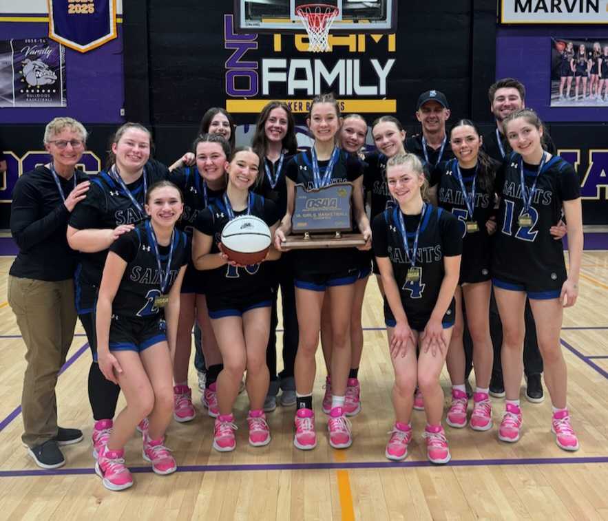The North Clackamas Christian girls basketball team poses with the 1A state trophy