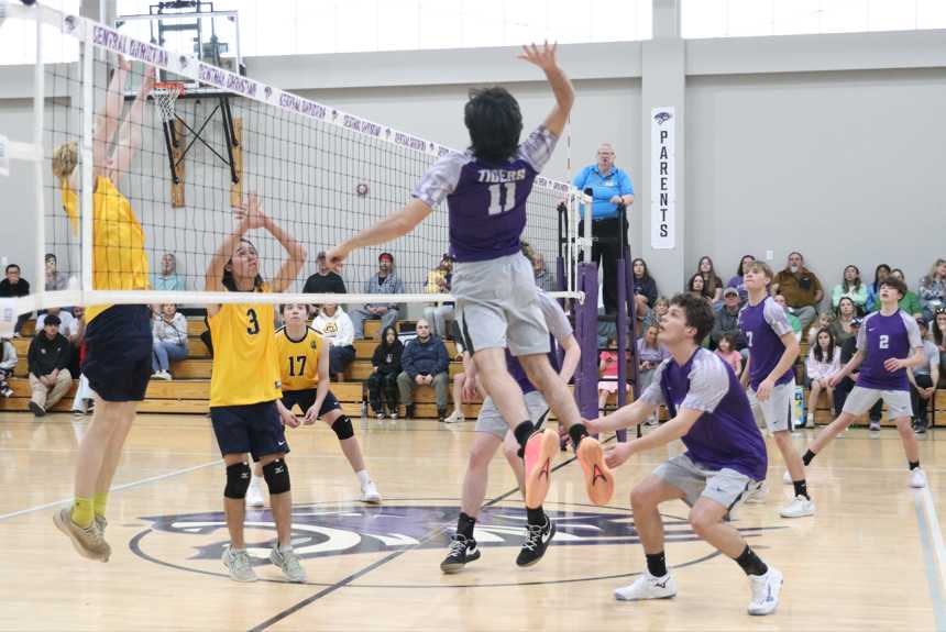 Central Christian's Jacon Contreras (11) jumps up for a spike against Bend. (Photo by Shannon Polk)