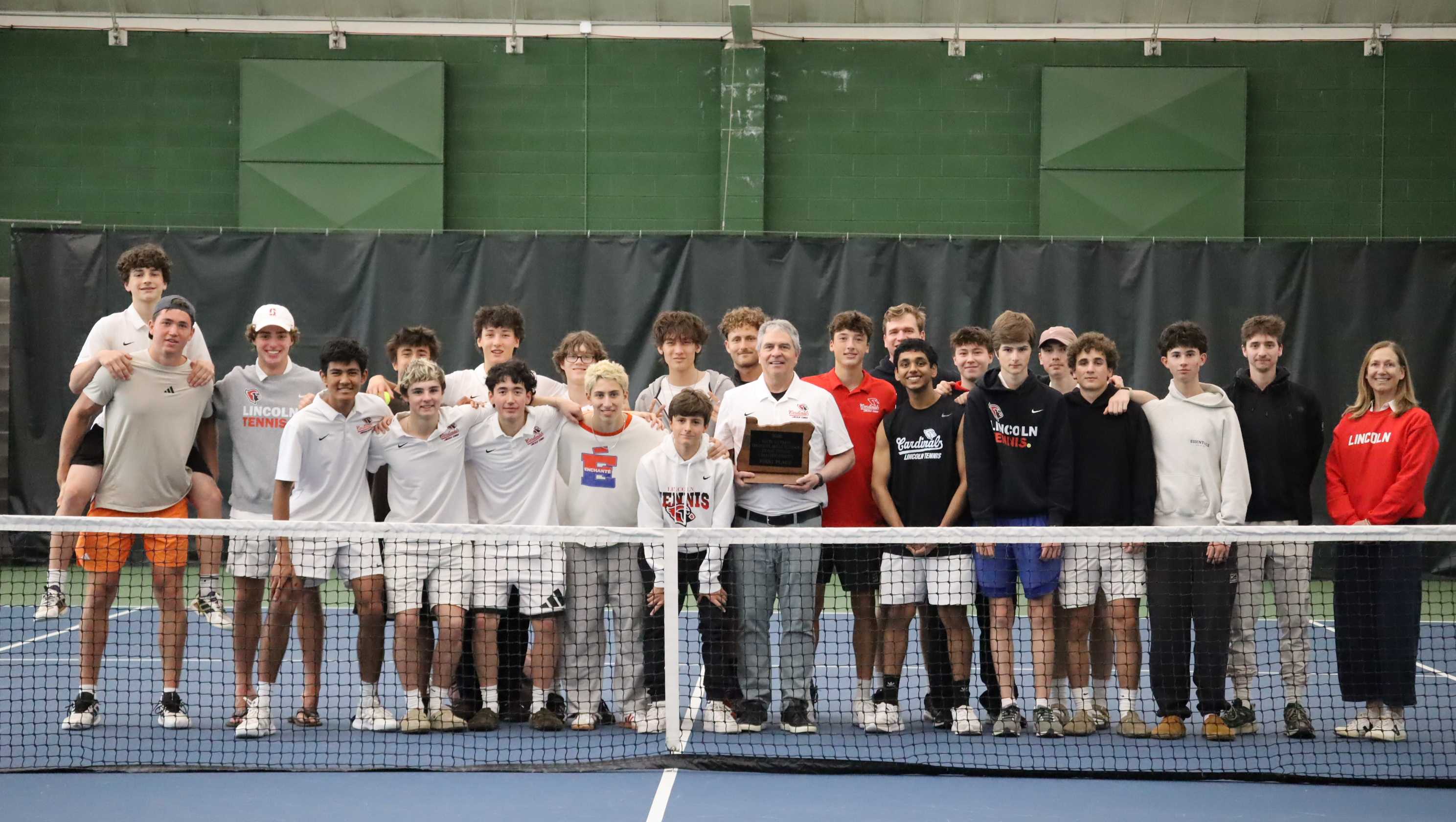 The Lincoln boys tennis team poses with the team trophy at a tournament hosted by Jesuit. (Photo from Stuart Allen)