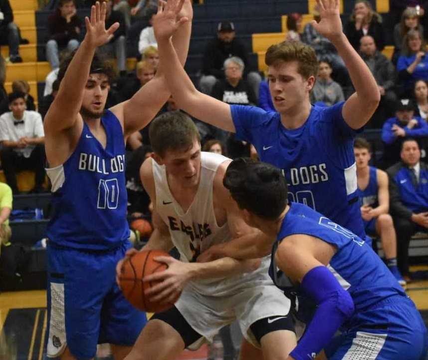 Stayton's Kaleb Anundi is surrounded by Woodburn's (from left) Ryan Stebner, RJ Veliz and Reese Miller. (Jeremy McDonald)