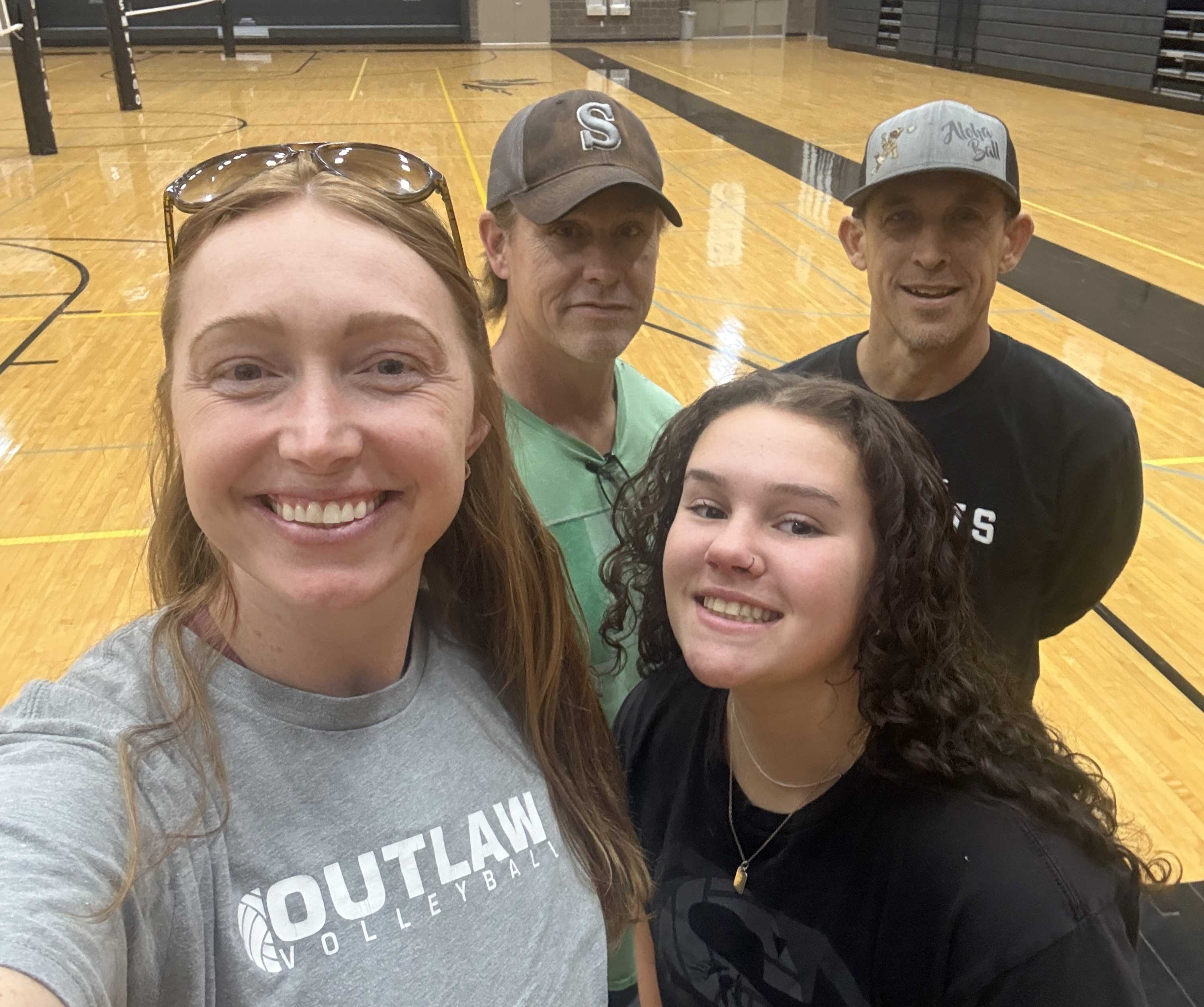 New Sisters head coach Jason Monaghan, middle, with the rest of the new volleyball staff. (Photo from Jason Monaghan)
