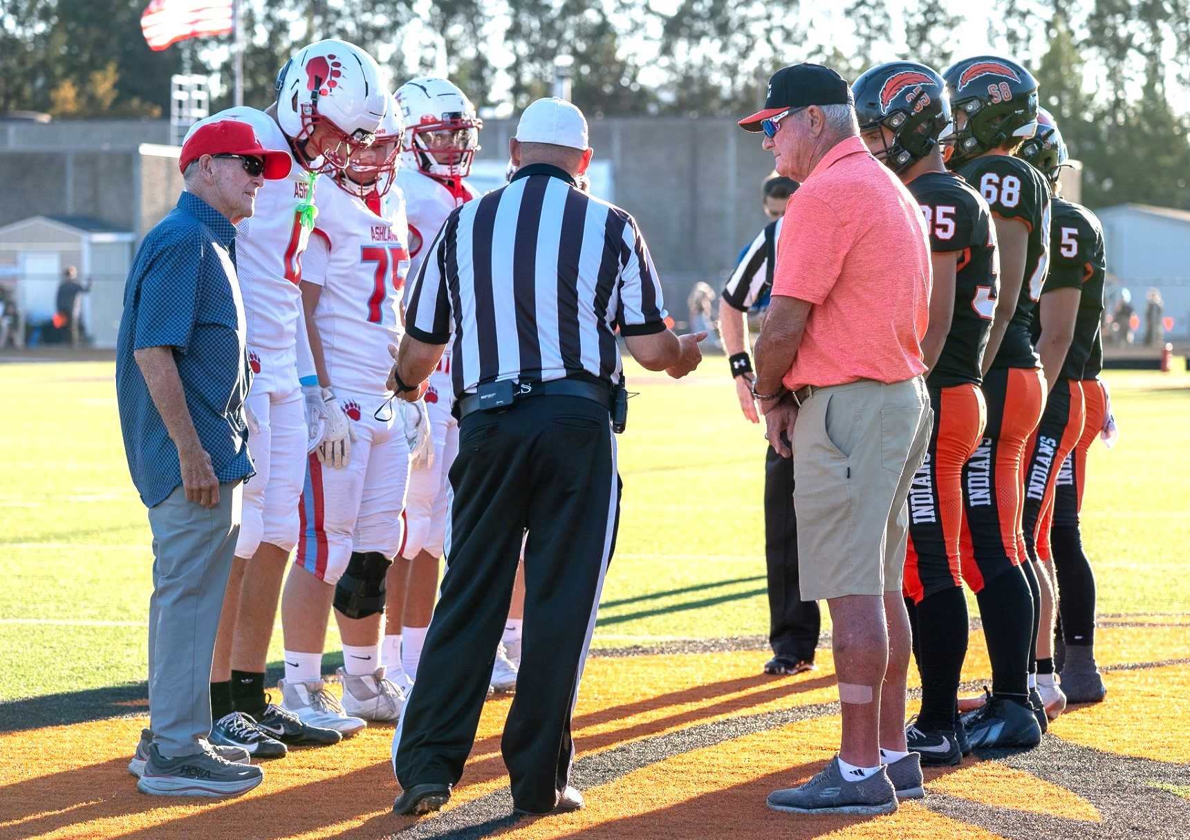 Ex-coaches Jim Nagel of Ashland (left) and Thurman Bell of Roseburg (right) were honorary captains Friday. (Jessie Smith)