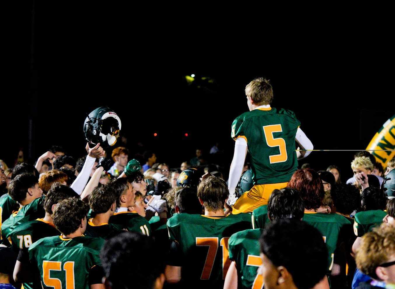 Putnam football players celebrate ending a 29-game losing streak after a win