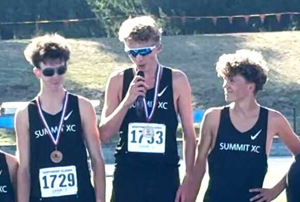 Summit junior Clayton Jero (center) won the Northwest Classic on Saturday, leading his team to second place behind Lincoln.