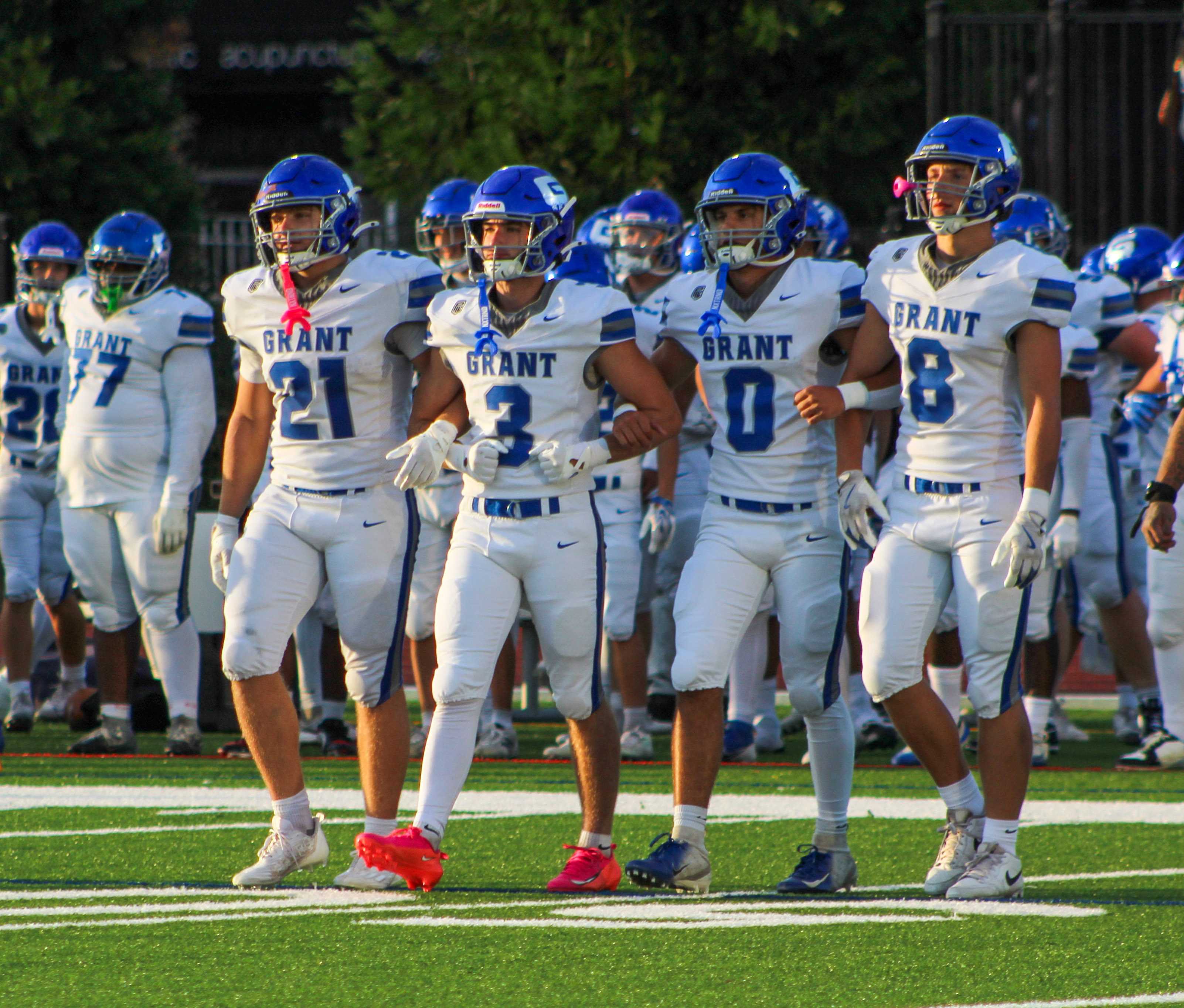 Grant football's captains come out for the coin toss against Lincoln in Week 1. (Photo by Austin White)