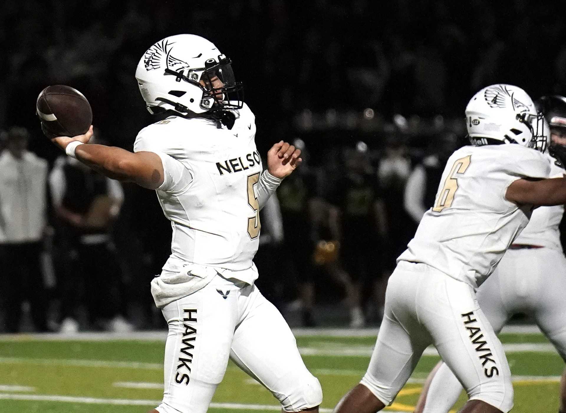 Nelson senior Braylon Gaines passed for 230 yards and three touchdowns in Friday's win at West Linn. (Photo by JR Olson)