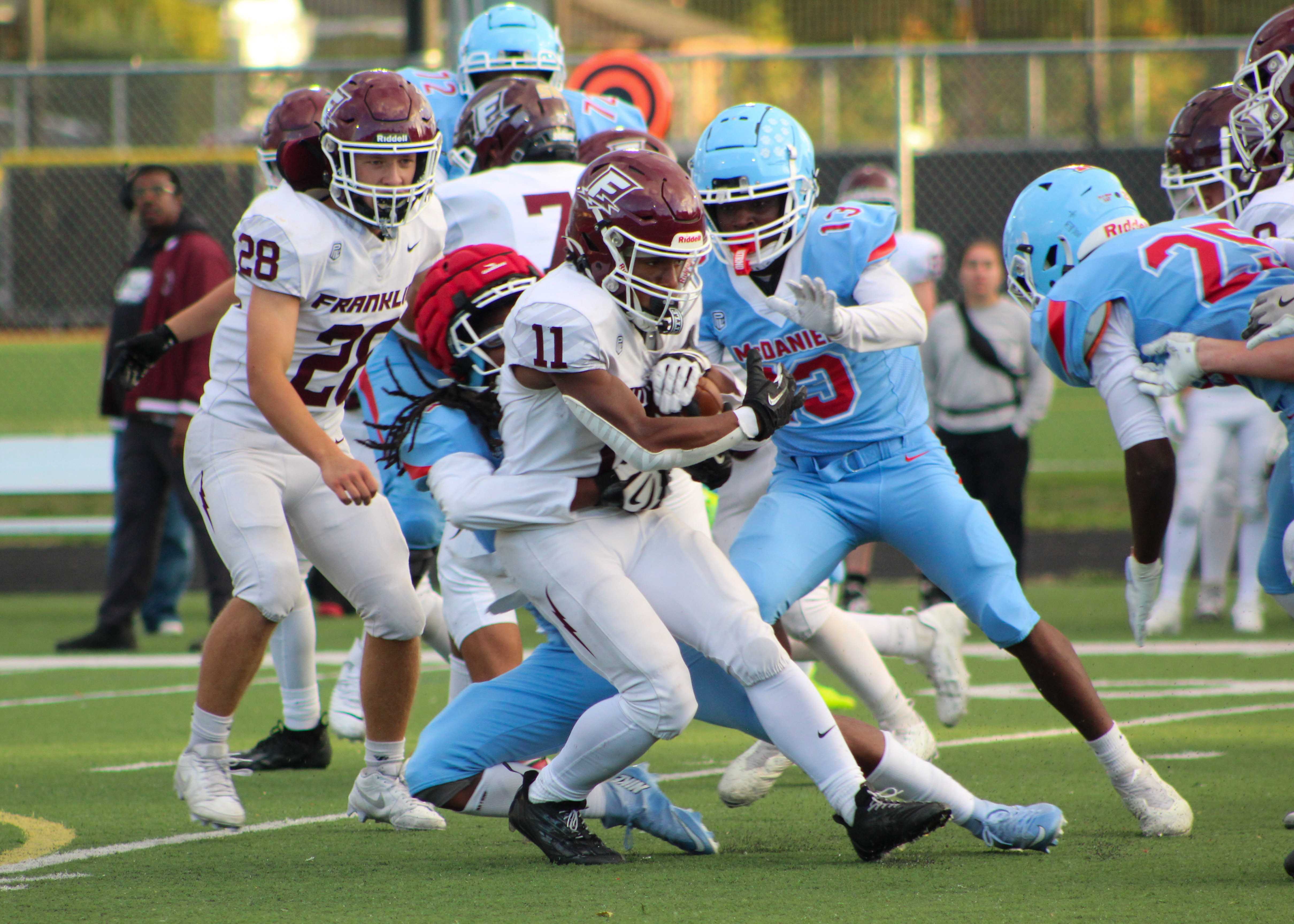 Franklin running back LaQuante James runs the ball against McDaniel. (Photo by Austin White)