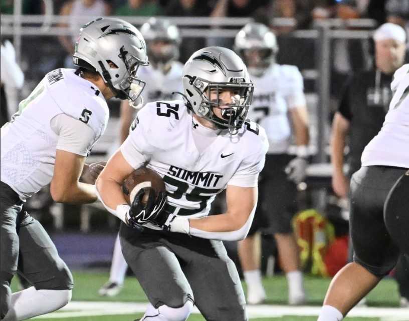 Clay Johnson rushed for 192 yards and two touchdowns in Summit's 14-13 win over Ridgeview on Friday. (Photo by Kris Cavin)