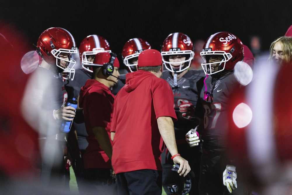David Douglas head coach Tyler Maes talks with the team during a 49-6 win over Centennial. (Photo by Ben Teese/Portland Preps)