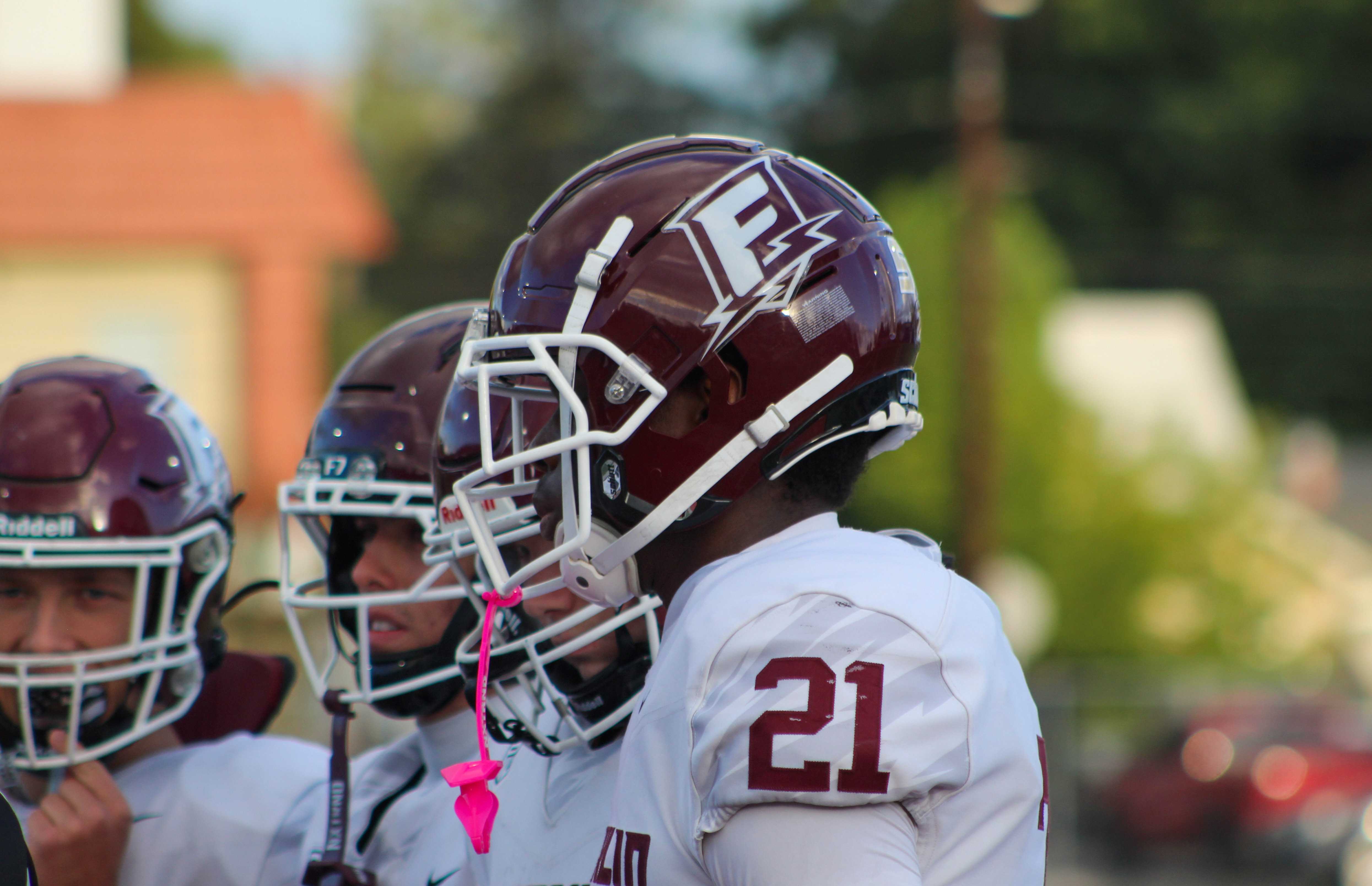 Franklin football players line up for the coin toss before a game with McDaniel. (Photo by Austin White)