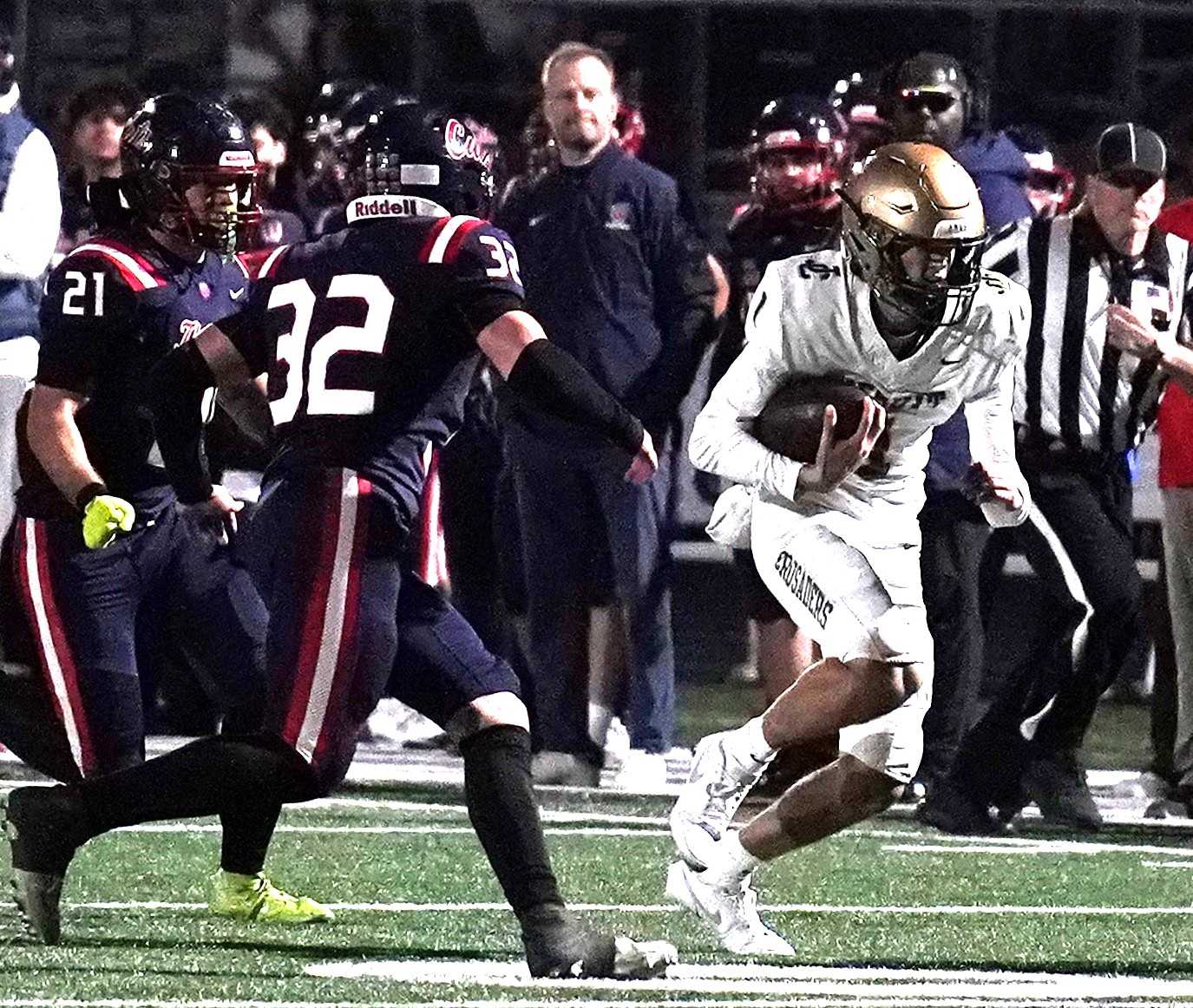 Jesuit quarterback Jack Wilson evades Westview's Creighton Trump (32) in Friday's Metro League game. (Photo by JR Olson)