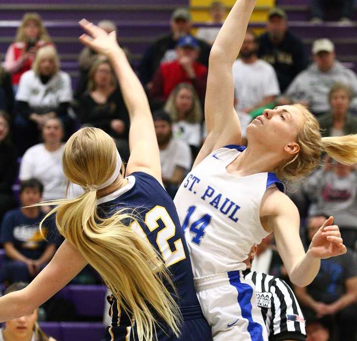 St. Paul's Isabelle Wyss (14) goes up against Joseph's Haley Miller (12) on Thursday. (NW Sports Photography)