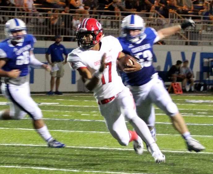 Oregon City's Zakhayas Dennis-Lee scored five touchdowns against Grants Pass.