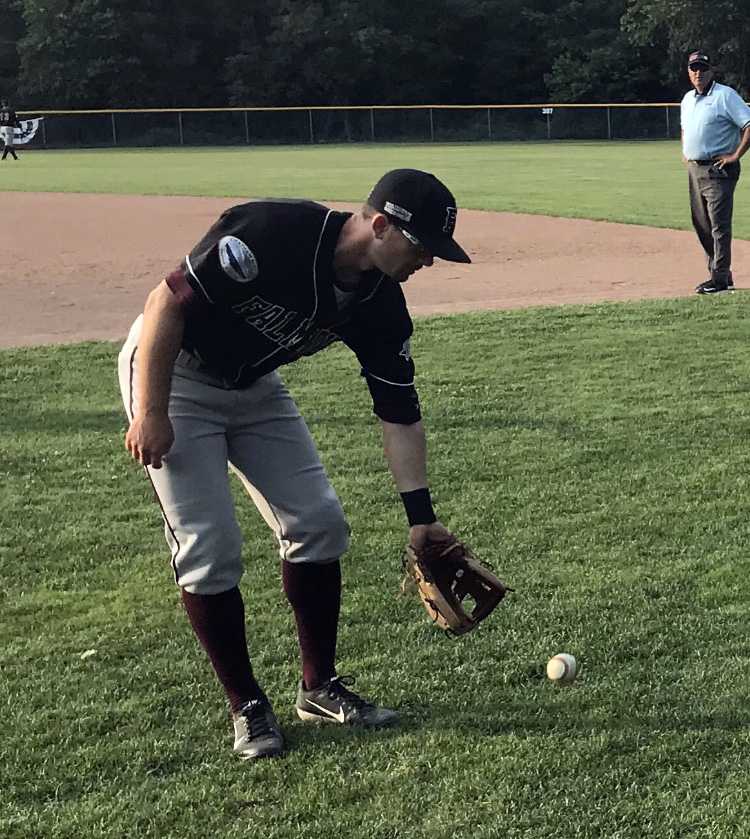 Playing catch between innings with some of the kids who come out to watch the games